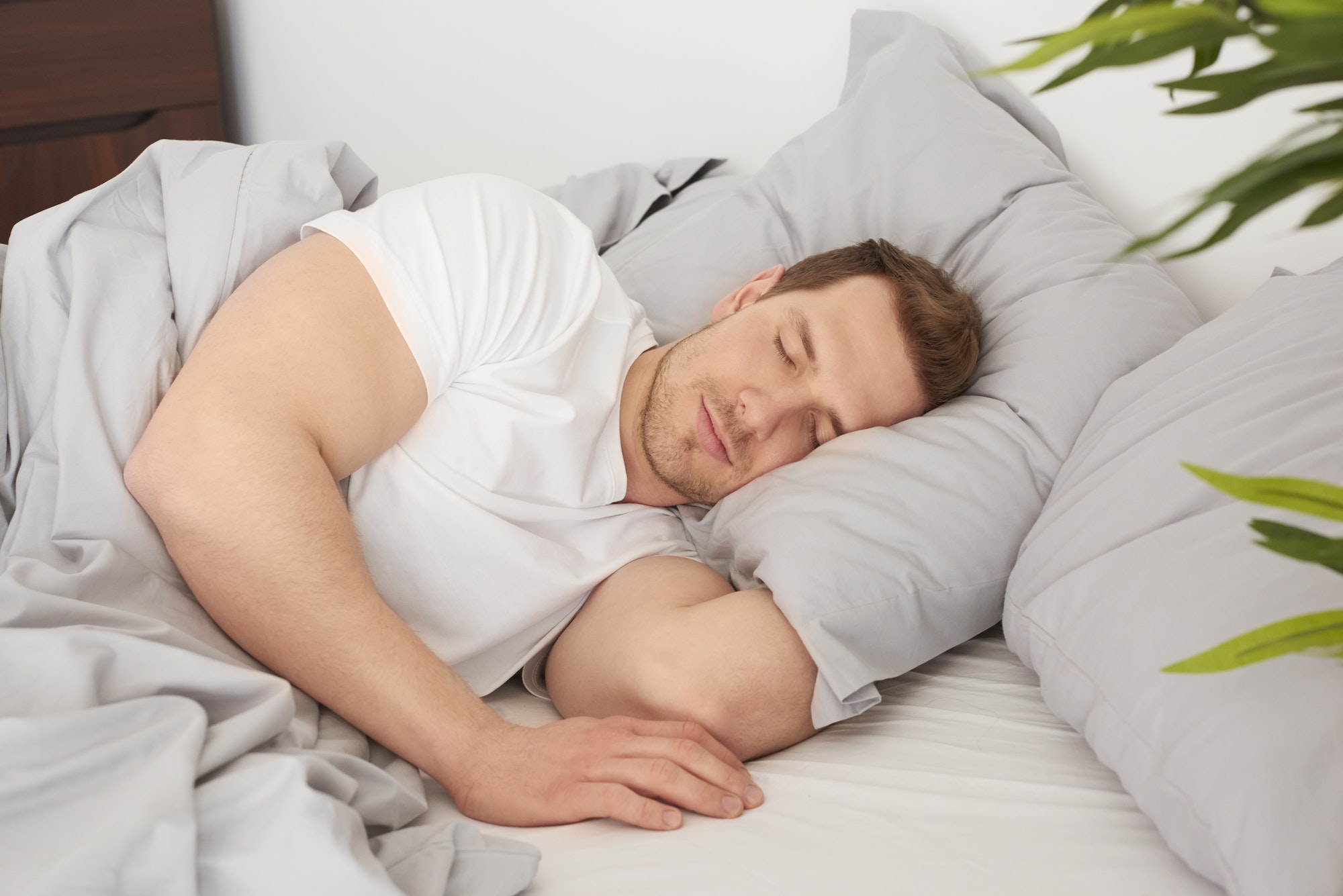 Man sleeping in the comfortable bed